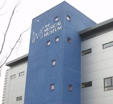 Exterior of the Medical Museum, featuring a blue facade with windows.